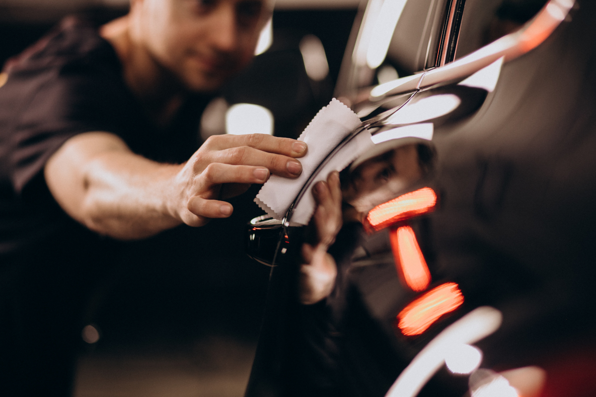 technician polishing car